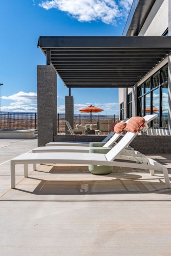 White sunloungers by the pool